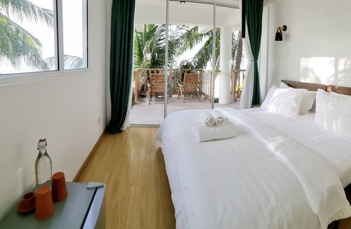 Thulusdhoo Island Hotel | Overlooking ocean that meets cloudless sky, Coral Inn is a sanctuary of serenity